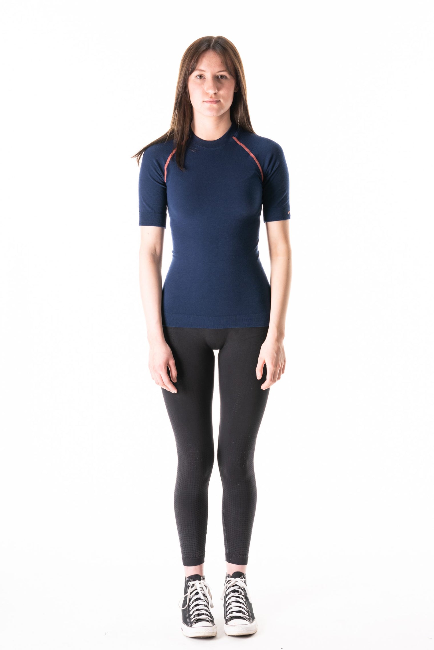 Model wearing Loomi Betatec short Sleeve Merino Base Layer, front view.