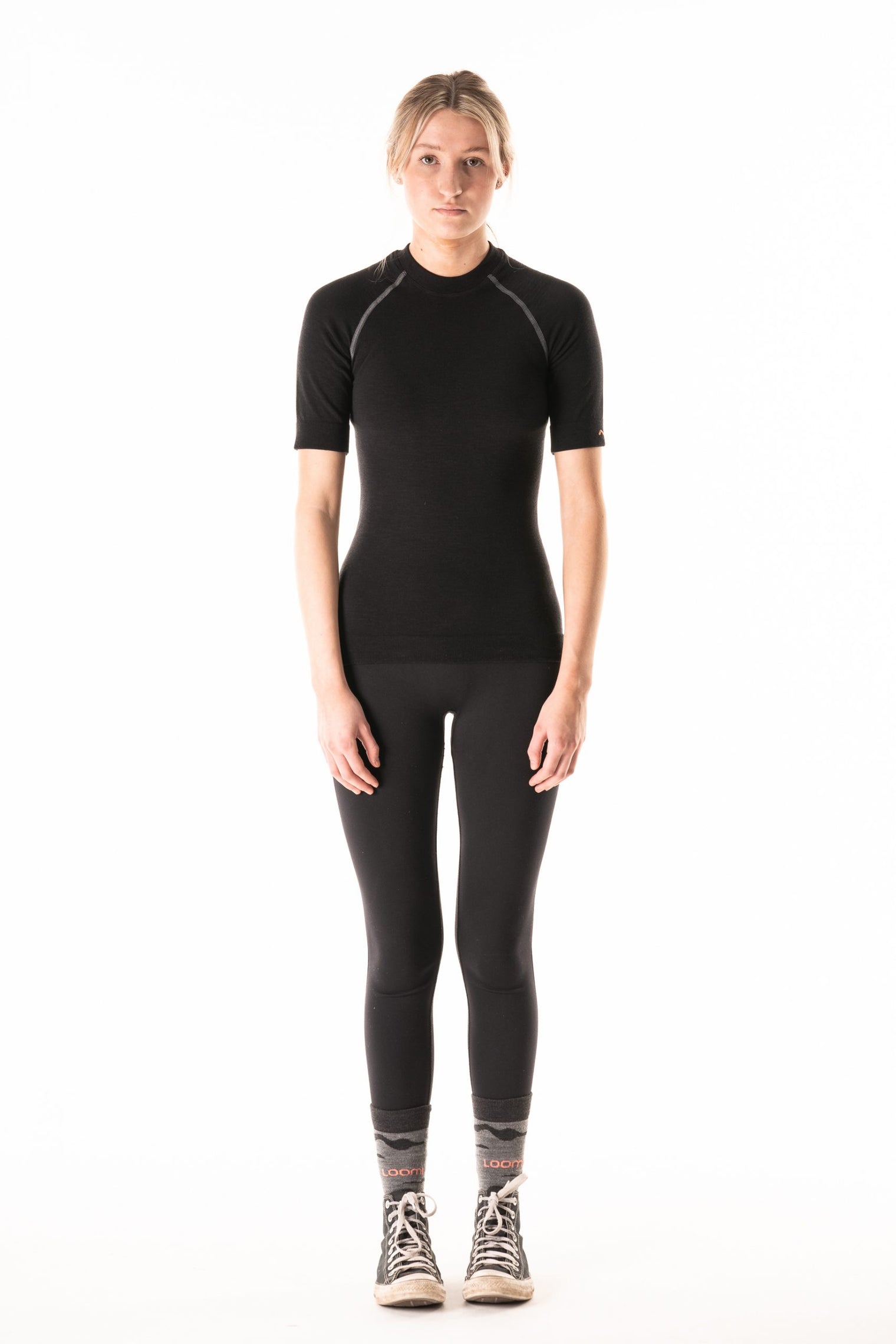 Model wearing Loomi Betatec short Sleeve Merino Base Layer, front view.