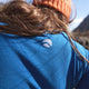 Close up of knitted Loomi logo on rear shoulder of Merino Base Layer.