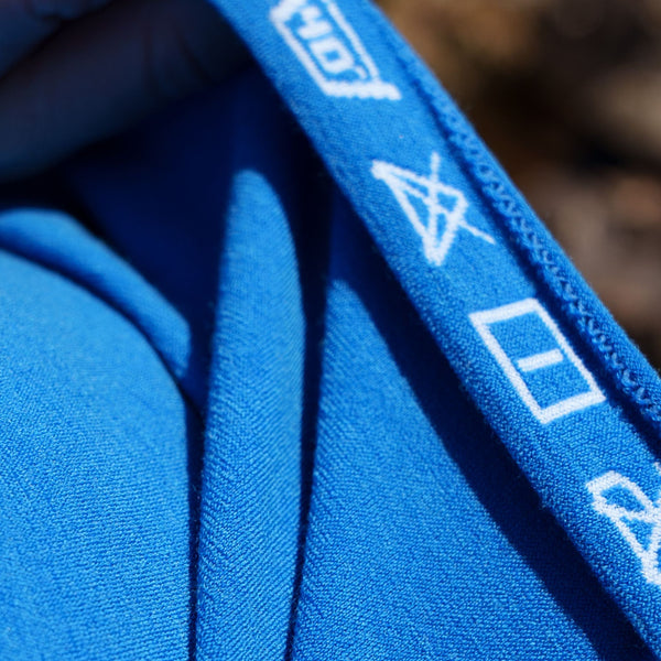 Close up of integrated washing label on Loomi Base Layer.